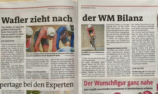 Eine deutschsprachige Zeitung zeigt zwei Hauptartikel über den Radsport mit Fotos von Radfahrern in Aktion: eine Nahaufnahme von zwei Rennfahrern mit Helmen und eine weitere von einem einzelnen Radfahrer, der ein Rennen auf einer Bahn in der Halle fährt.