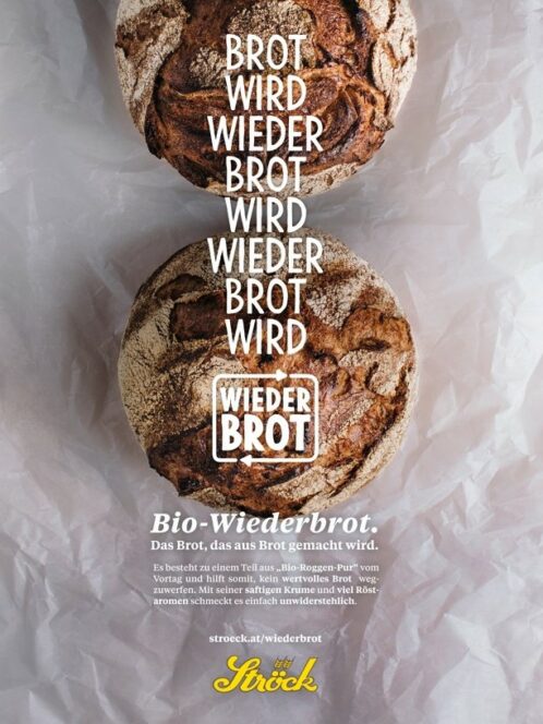 Zwei runde Laibe handwerklich hergestellten Brotes auf einer weißen Fläche mit überlagertem deutschen Text, der für Wiederbrot und Nachhaltigkeit wirbt. Das Brot wirkt rustikal und frisch gebacken.