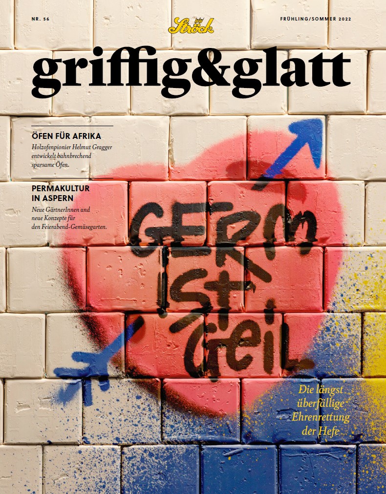 Eine gekachelte Wand zeigt ein großes rosa Herz mit einem blauen Pfeil und dem deutschen Graffiti-Text GERM ist geil in schwarzer Farbe. Der Zeitschriftentitel griffig & glatt erscheint oben in gelber und schwarzer Schrift.