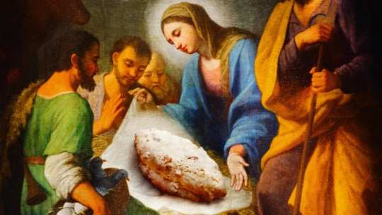 Ein klassisches Gemälde einer Krippe mit vier Personen, die um eine Wiege versammelt sind, aber statt des Jesuskindes liegt ein mit Puderzucker bestreuter Brotlaib auf dem Tuch.