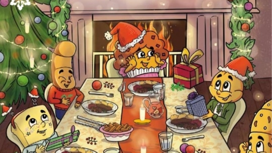 Four cartoon cheese characters in festive hats sit around a holiday dinner table near a decorated Christmas tree and fireplace, exchanging gifts and smiling, with plates of food and candles on the table.