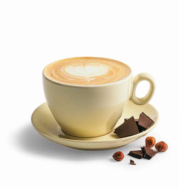 Ströck Bio-Schoko-Nuss-Cappuccino mit Bio-Espresso, Haselnuss-Sirup, peruanischer Schokolade und Milchschaum, serviert in einer Tasse.